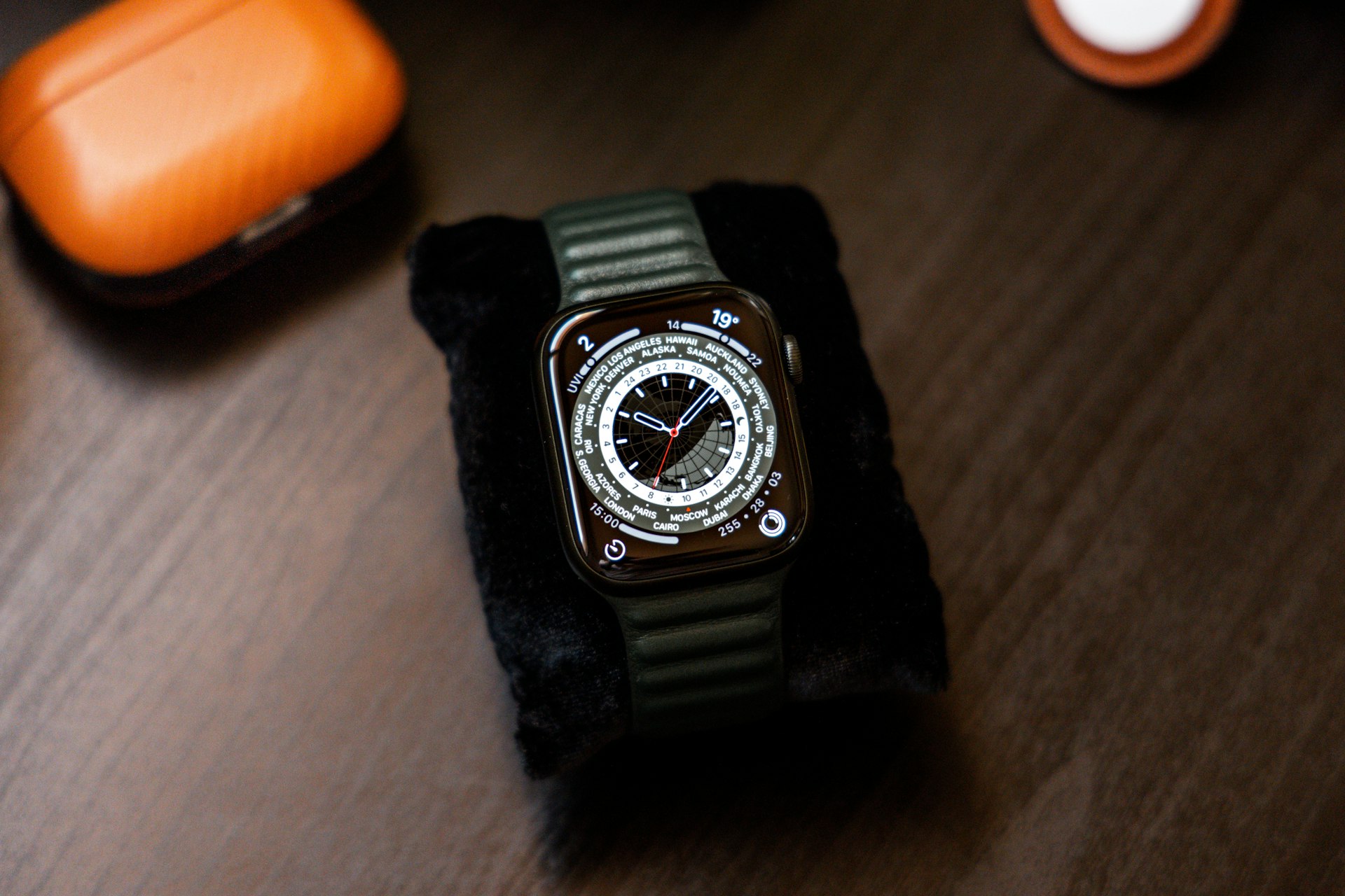 a watch sitting on top of a wooden table